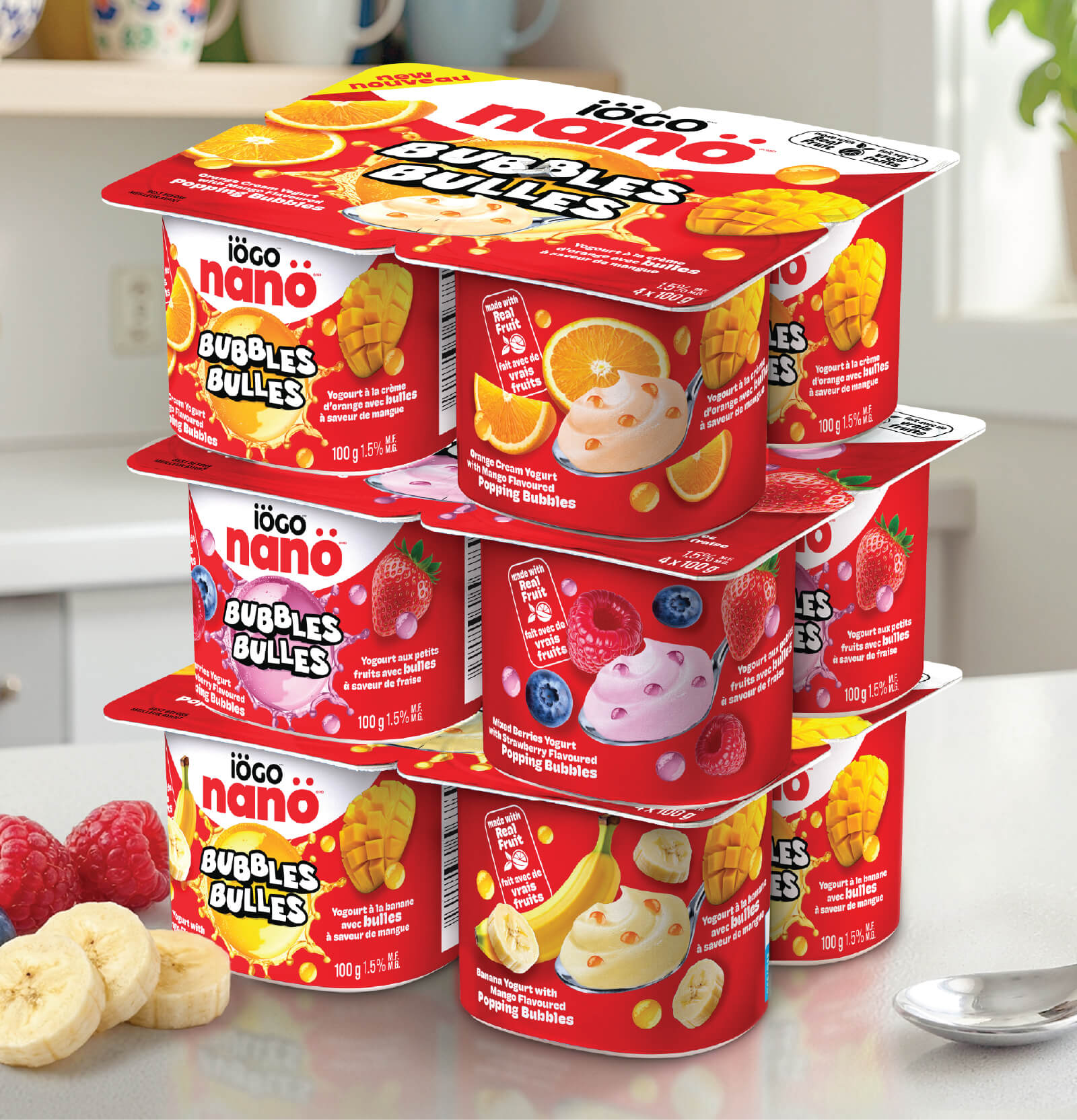 Stacked yogurt containers on a tabletop displaying the different flavors.